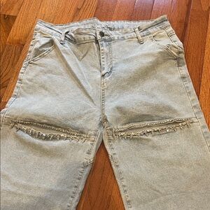 Light wash jeans with cut outs and gems